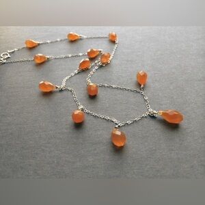 Elegant Silver Necklace with Orange Accents